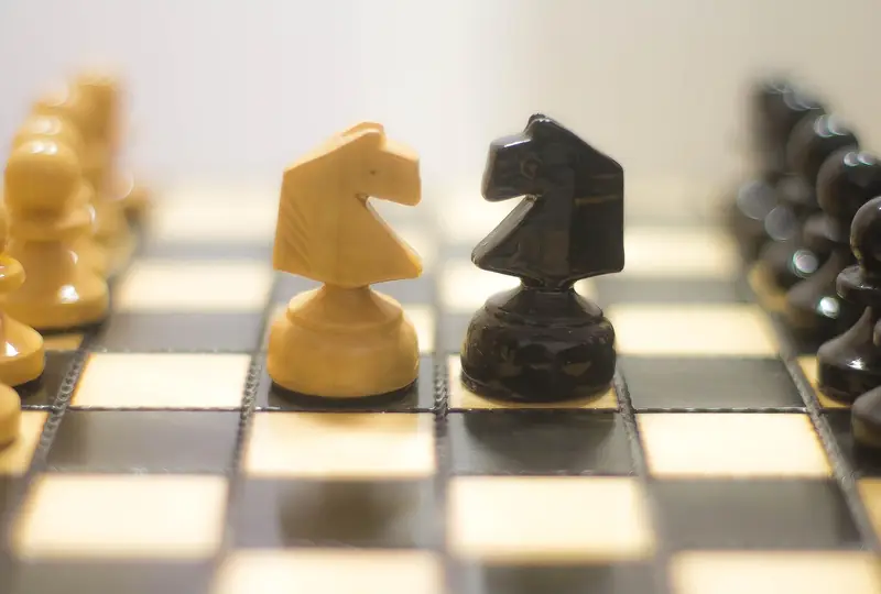 Chess pieces poised on the board, evoking deep calculation and visualisation during a game.