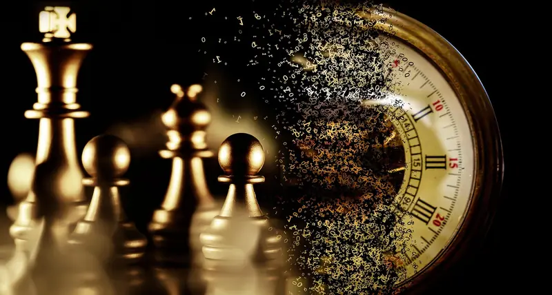 A chess clock beside the pieces on a board, capturing the time pressure of tournament play.