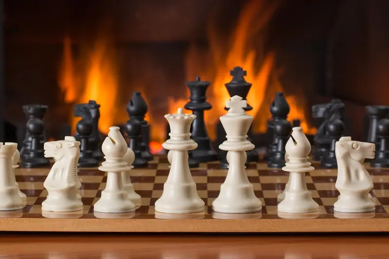 A chess king and pawns on a wooden board in warm light, suggesting a quiet king-and-pawn endgame.
