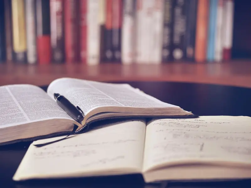 An open book in a library, representing a structured chess study plan and reading.